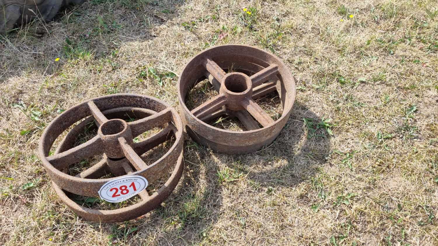 Lot 281 - Antique cast iron shed wheels