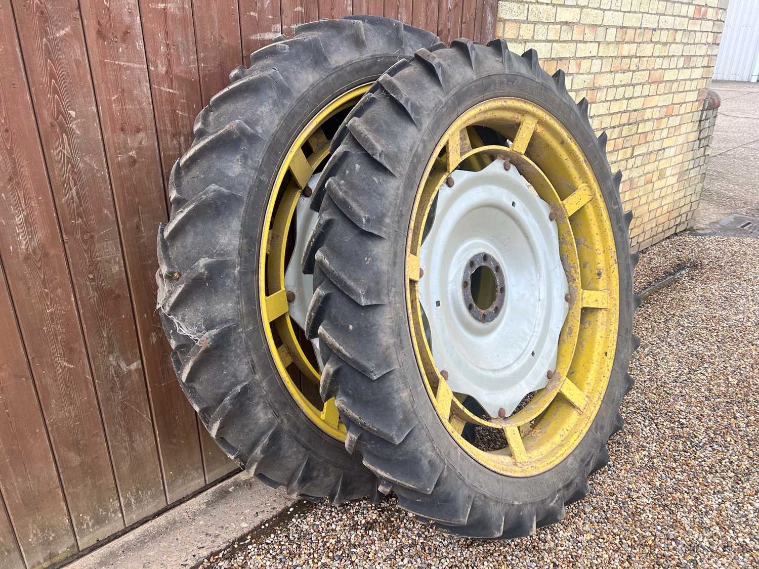 Lot 60 - Pair of rear row crop wheels. MF centres. 9.5-